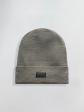 Load image into Gallery viewer, Gray Satin Lined beanie with a black label on a light gray background