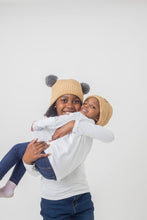 Load image into Gallery viewer, Adult Sized Tan and Grey Pom Pom Satin Lined Beanie - Black Sunrise UK Satin Lined Hats,. Satin lined Beanie, Hoodies. For children, adults, babies. For those with curly natural hair, sensitive scalps and fragile curls.