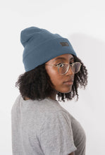 Load image into Gallery viewer, Person wearing a Satin Lined  blue beanie and gray shirt on a white background

