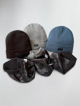 Load image into Gallery viewer, Set of satin lined beanies in black, gray, and blue on a light gray background
