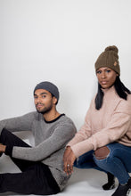 Load image into Gallery viewer, Olive Satin Lined Bobble Hat - Black Sunrise UK Satin Lined Hats,. Satin lined Beanie, Hoodies. For children, adults, babies. For those with curly natural hair, sensitive scalps and fragile curls.
