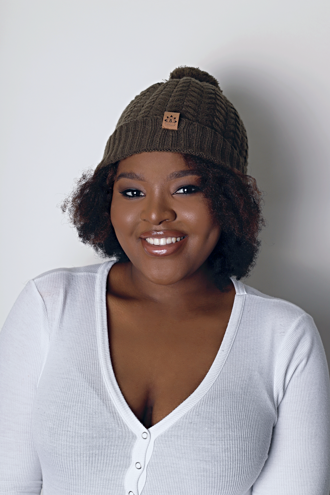 Olive Satin Lined Bobble Hat - Black Sunrise UK Satin Lined Hats,. Satin lined Beanie, Hoodies. For children, adults, babies. For those with curly natural hair, sensitive scalps and fragile curls.